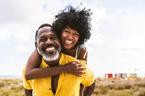 beautiful mature black couple of lovers dating at the seaside